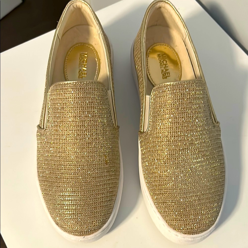Michael kors slip on gold metallic shoes size 7 medium.